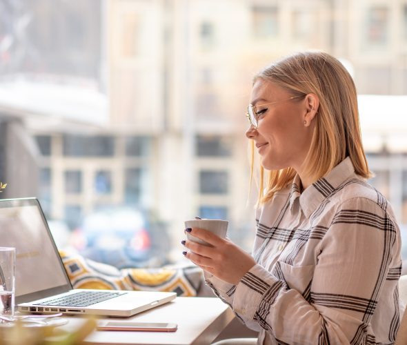 lady working at computer virtual low cost outplacement